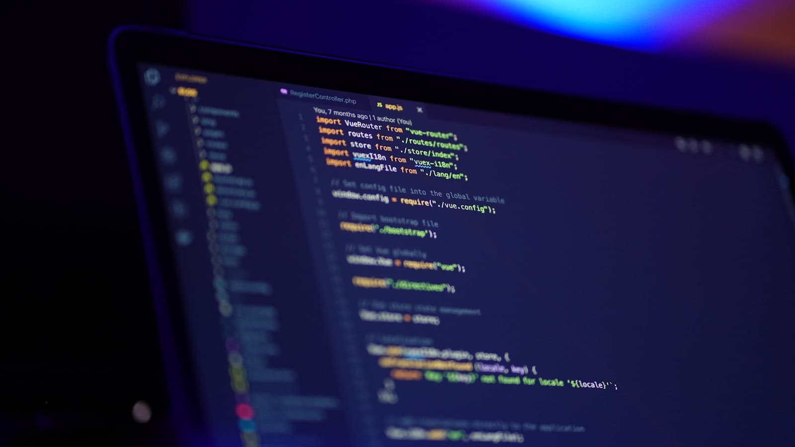 Laptop screen displaying colorful code with syntax highlighting